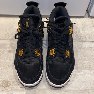 Black and gold Jordan 4’s